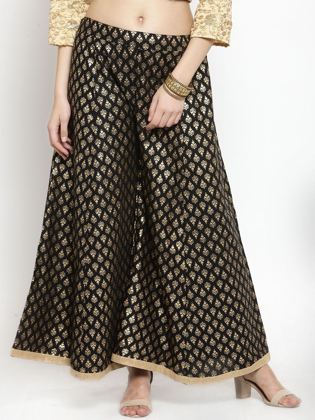 Clora Creation Women Black & Gold-Coloured Printed Flared Palazzos Price in India