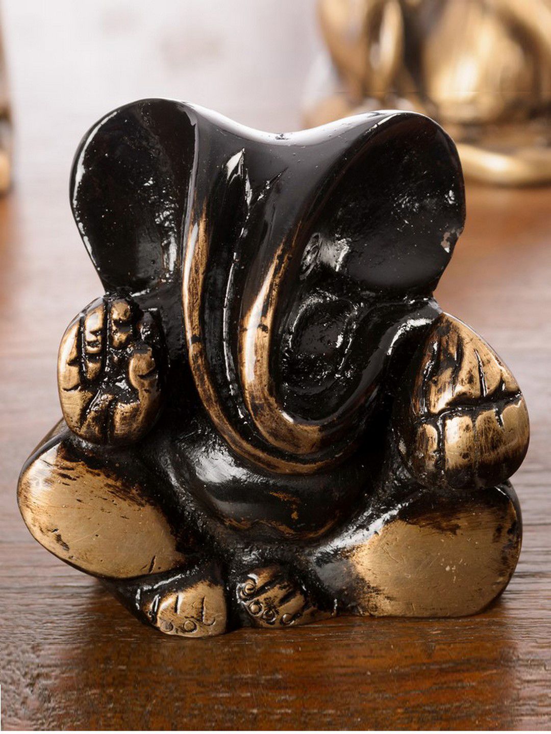 eCraftIndia Black & Gold-Toned Antique Finish Diving Ganesha Showpiece Price in India