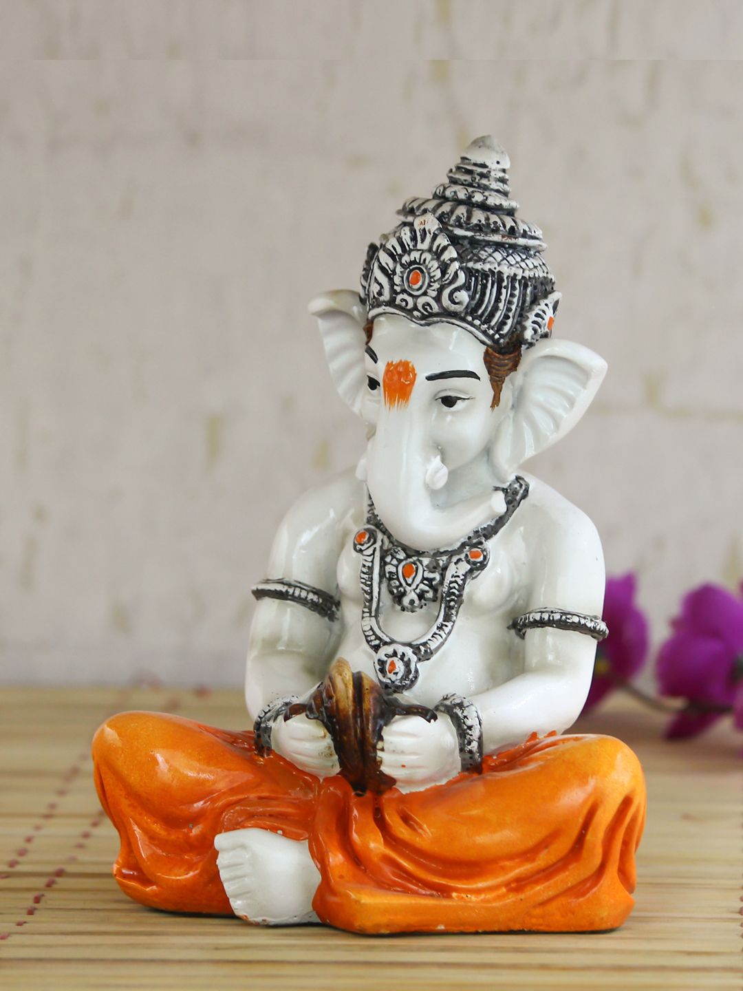 eCraftIndia Off White & Orange Lord Ganesha Playing Manjeera Showpiece Price in India
