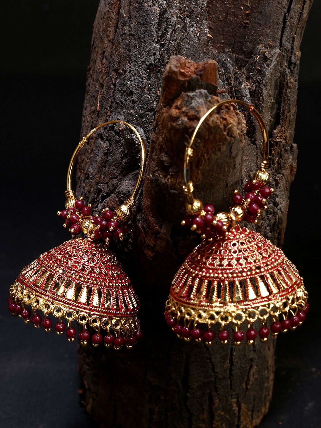 ANIKAS CREATION Maroon & Gold-Plated Enamelled Dome Shaped Jhumkas Price in India