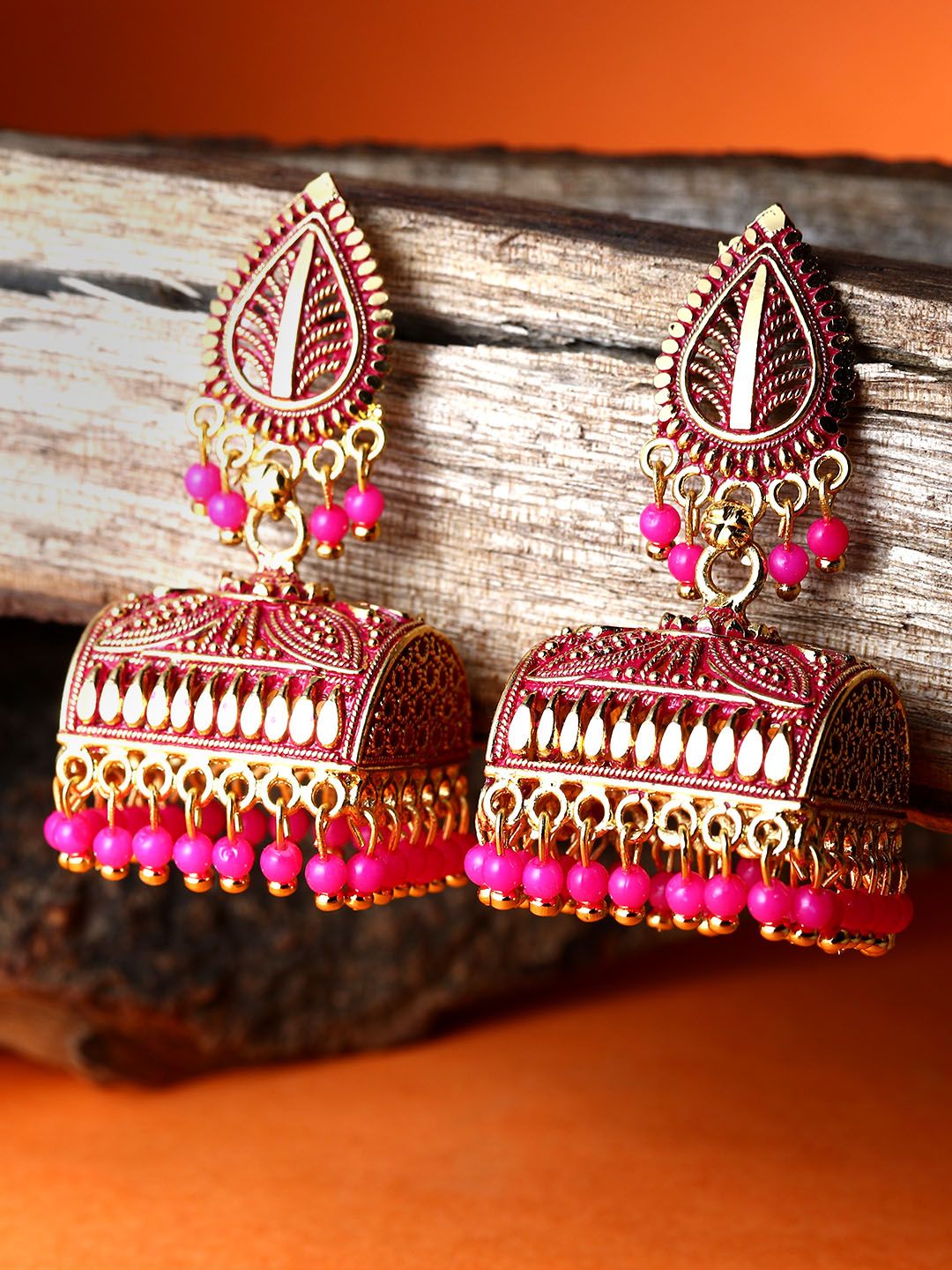 ANIKAS CREATION Gold Plated & Pink Leaf Shaped Enamelled Jhumkas Price in India