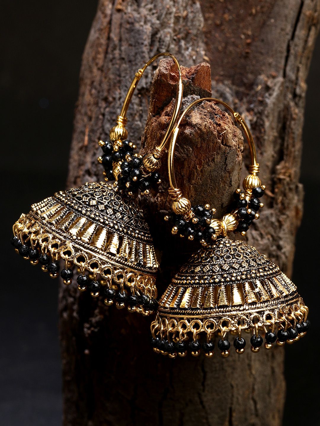 ANIKAS CREATION Black & Gold-Plated Enamelled Dome Shaped Jhumkas Price in India