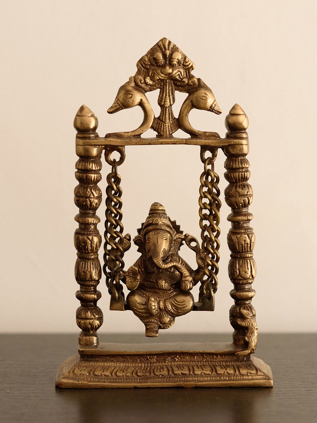 eCraftIndia Gold-Toned Brass Lord Ganesha on Jhoola Showpiece Price in India