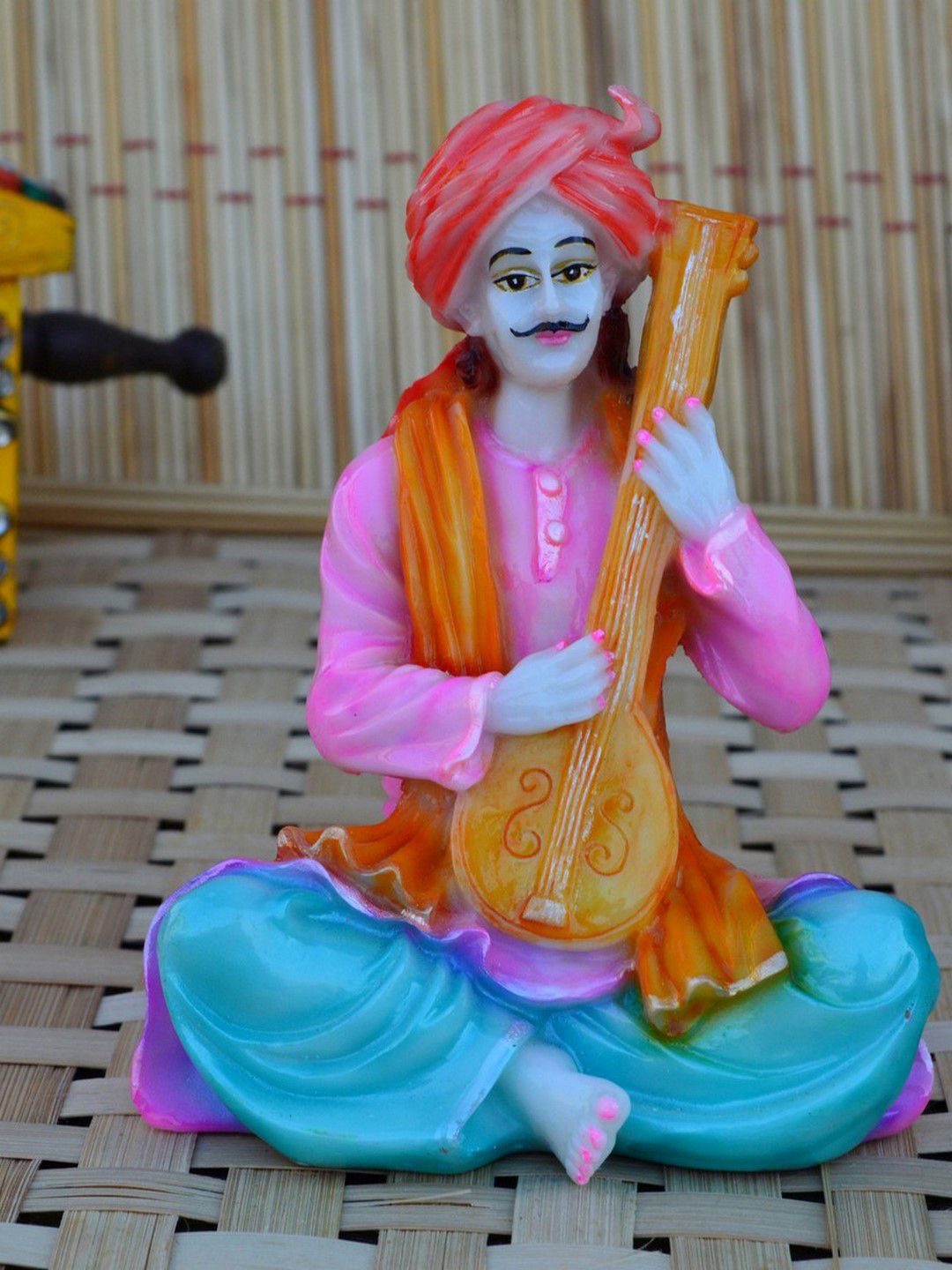 eCraftIndia Pink & Orange Polyresin Rajasthani Musician Sitar Showpiece Price in India
