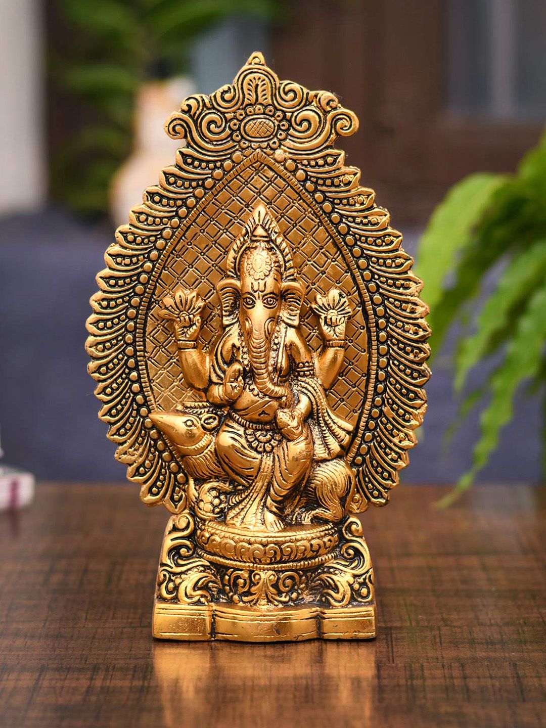 CraftVatika Gold-Toned & Black Ganesha Statue Showpiece Price in India