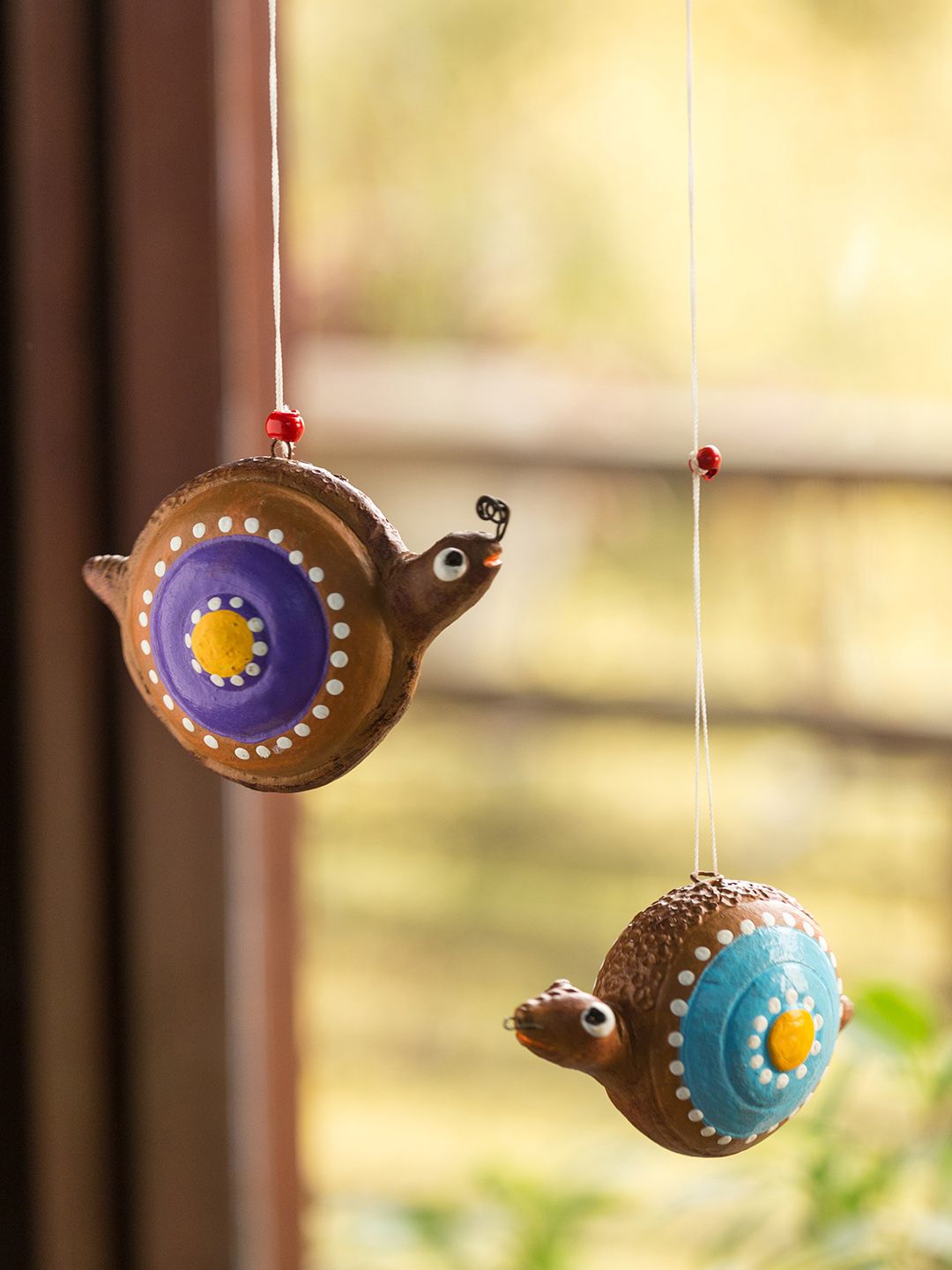 ExclusiveLane Set of 2 Brown Spiral Snails Hand-Painted Terracotta Hangings Price in India