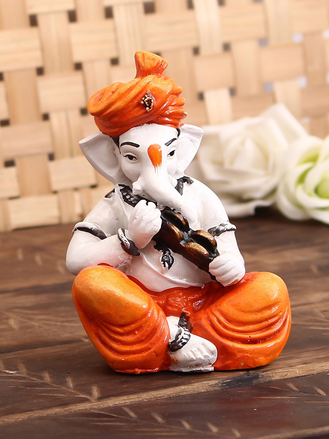 eCraftIndia Orange & Off-White Lord Ganesha Showpiece Playing Kartal Price in India