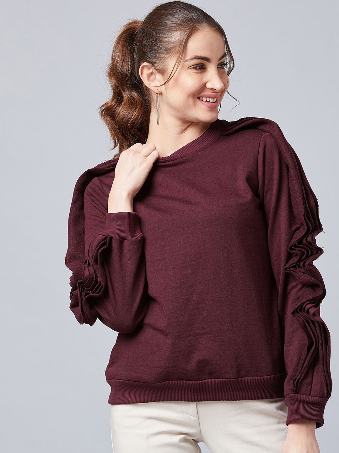 Athena Women Burgundy Solid Asymmetric Sleeve Sweatshirt Price in India