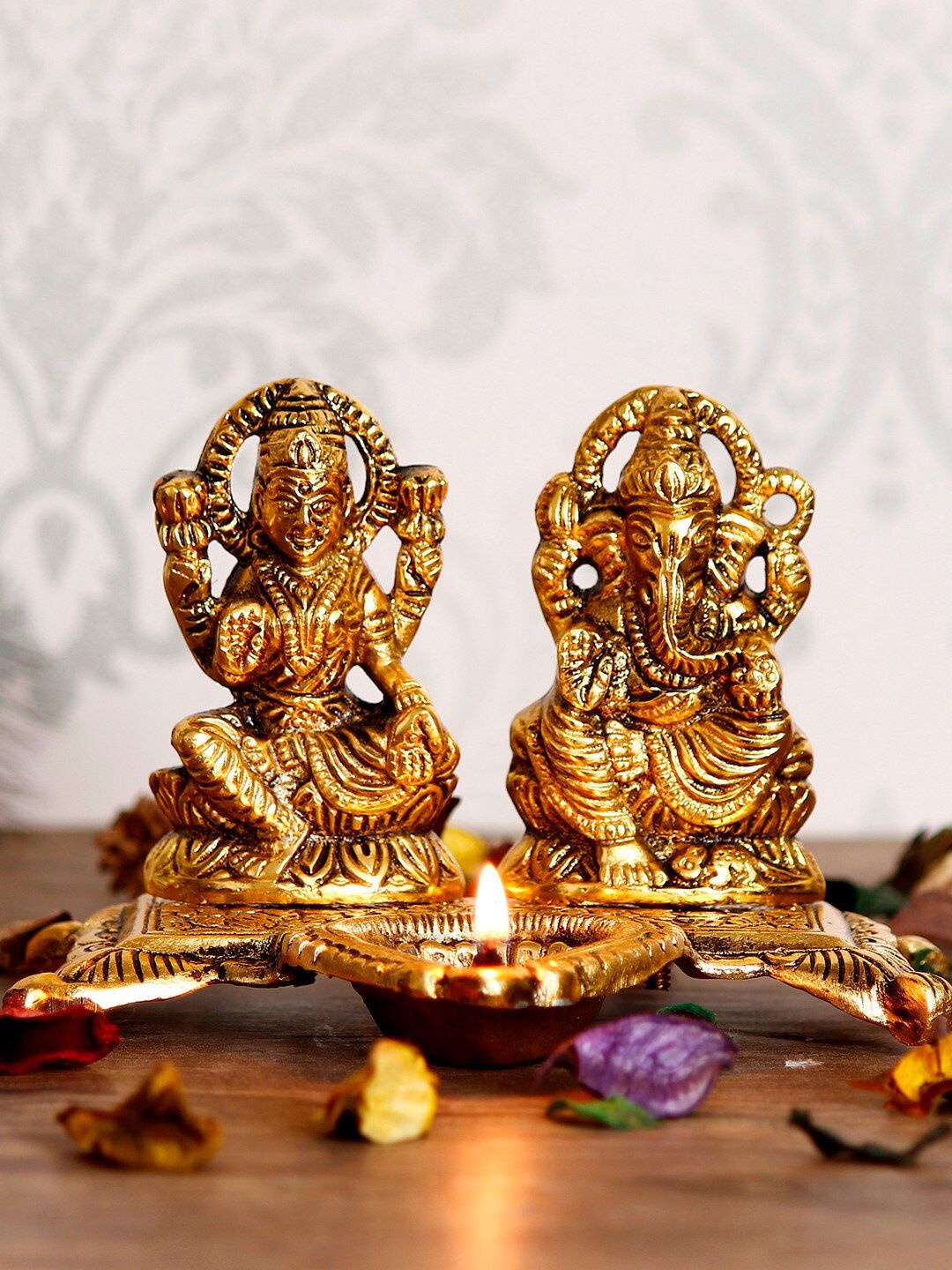 eCraftIndia Unisex Gold-Toned Lord Ganesha and Goddess Lakshmi Showpiece with Diya Price in India