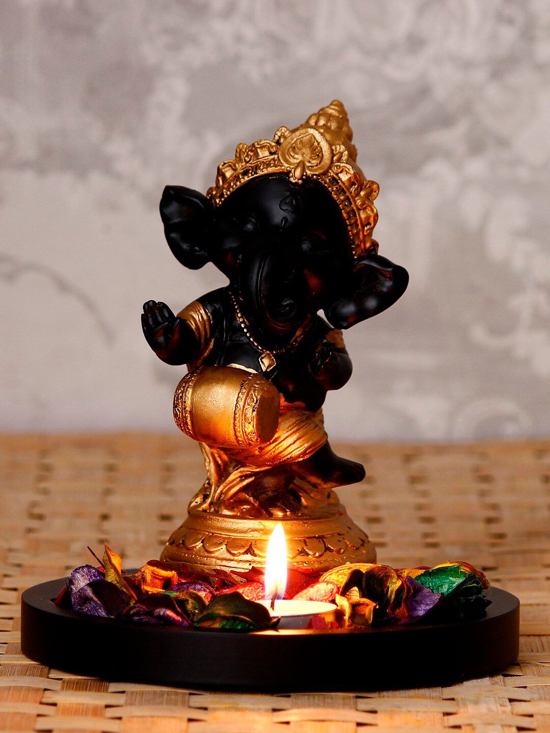 eCraftIndia Black & Gold-Toned Lord Ganesha Dancing Avatar Decorative Showpiece with Wooden Base, Petals and Tealight Price in India