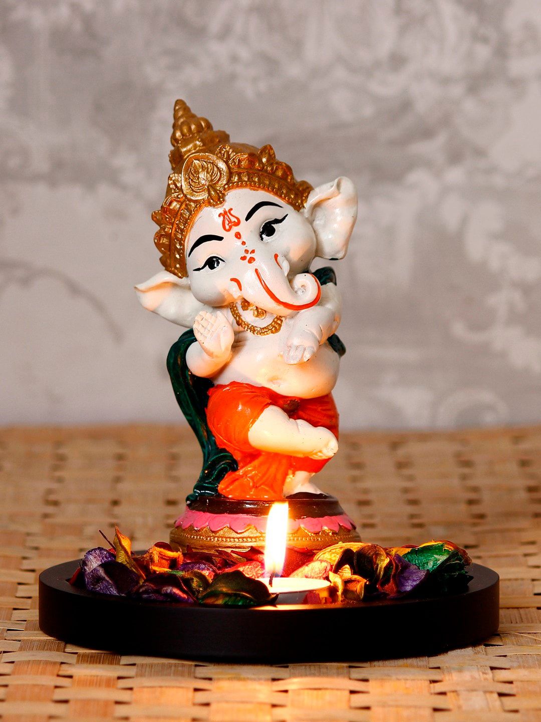 eCraftIndia Unisex Orange & White Lord Ganesha Dancing Avtaar Showpiece with Petals and Tealight Price in India