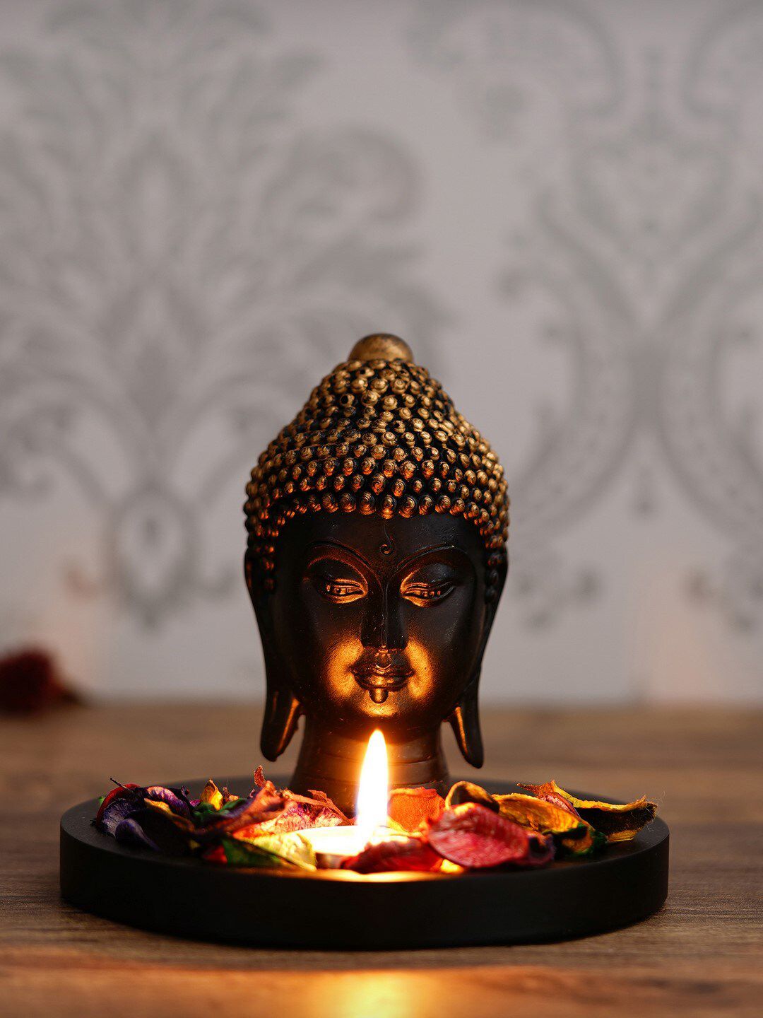 eCraftIndia Black & Gold-Coloured Lord Buddha Head with Wooden Base, Petals and Tealight Decorative Showpiece Price in India