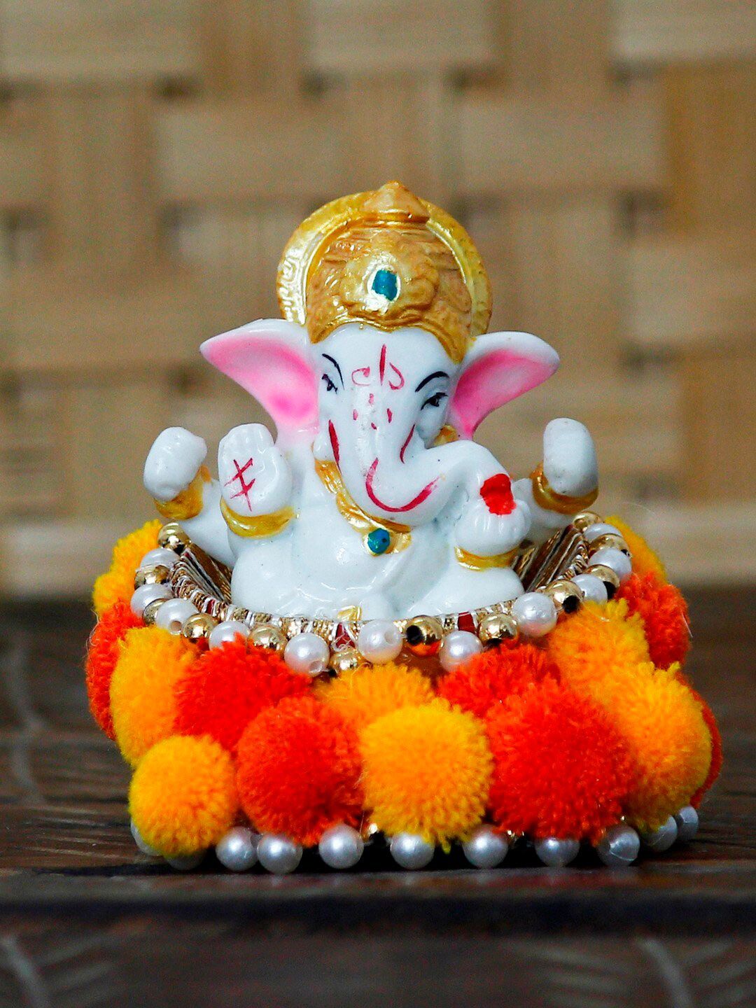 eCraftIndia White & Orange Lord Ganesha Idol Showpiece Price in India