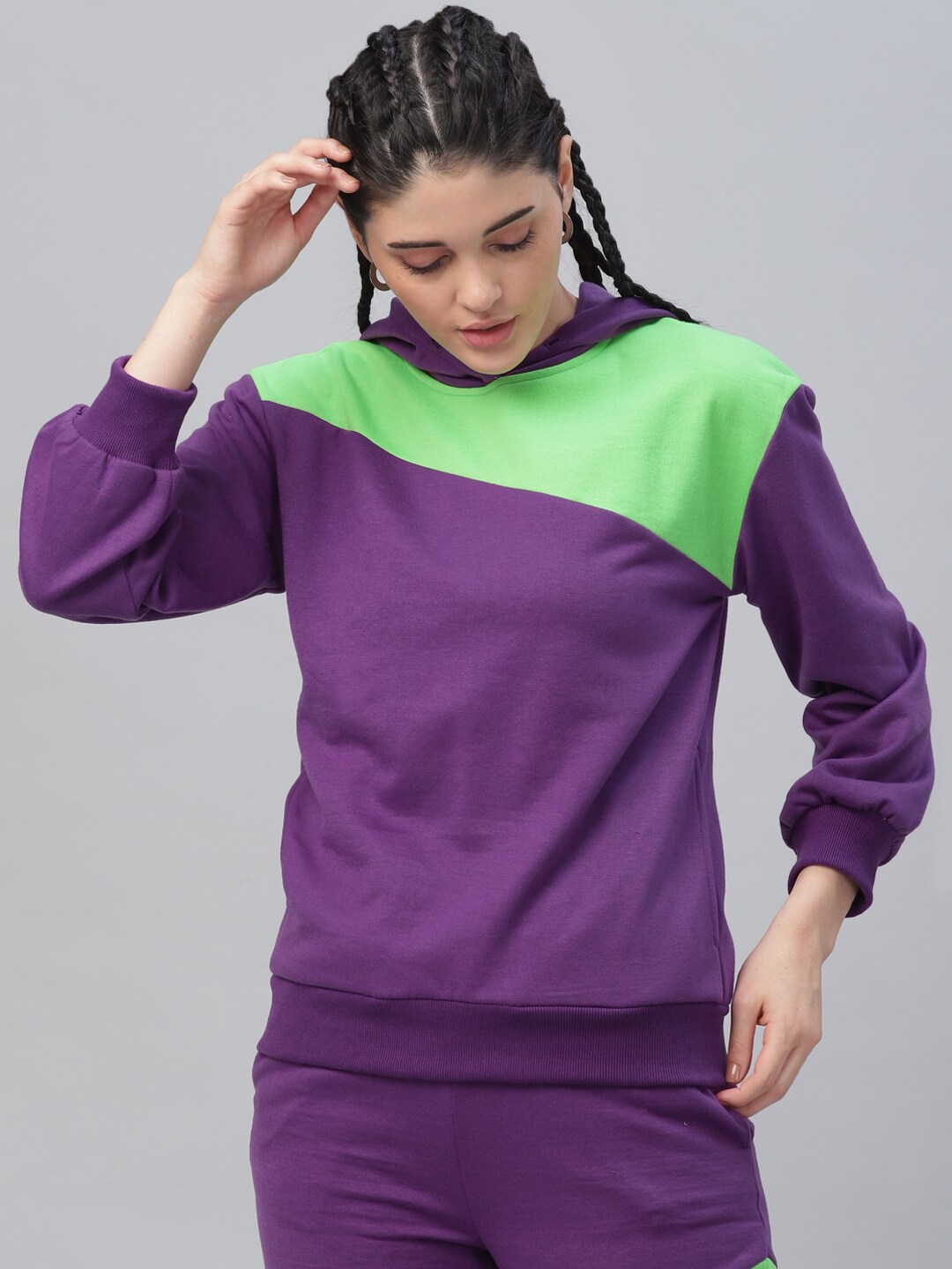 Athena Women Purple & Fluorescent Green Colourblocked Hooded Sweatshirt Price in India