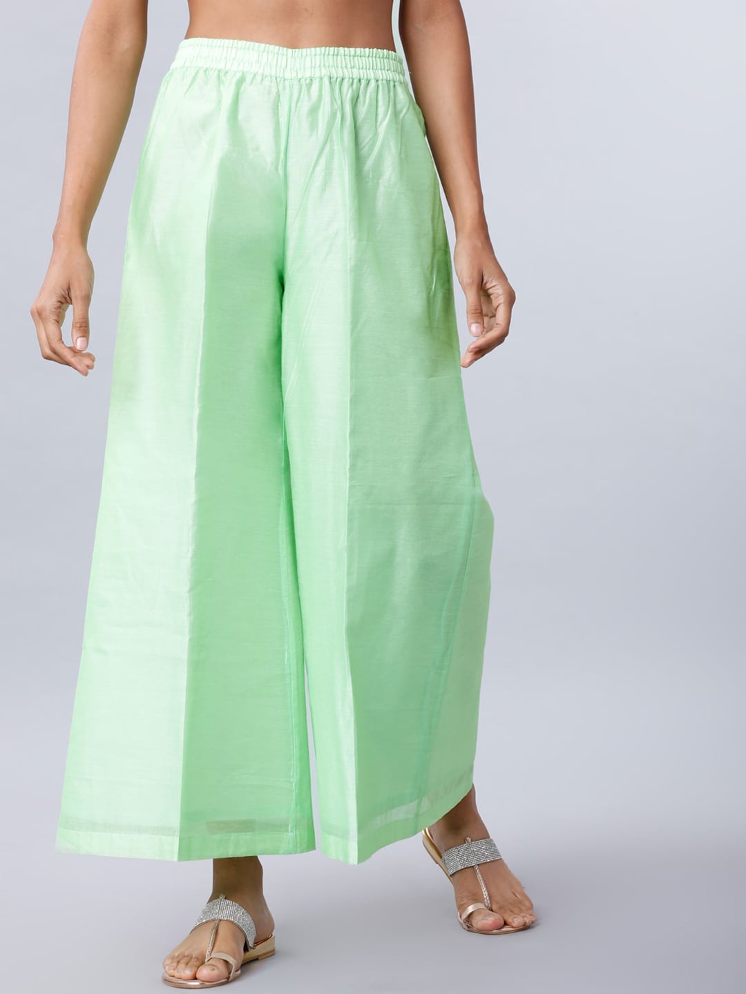 Vishudh Women Green Solid Straight Palazzos Price in India