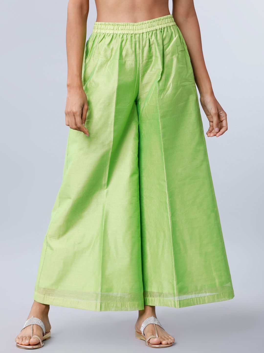 Vishudh Women Green Solid Flared Palazzos Price in India