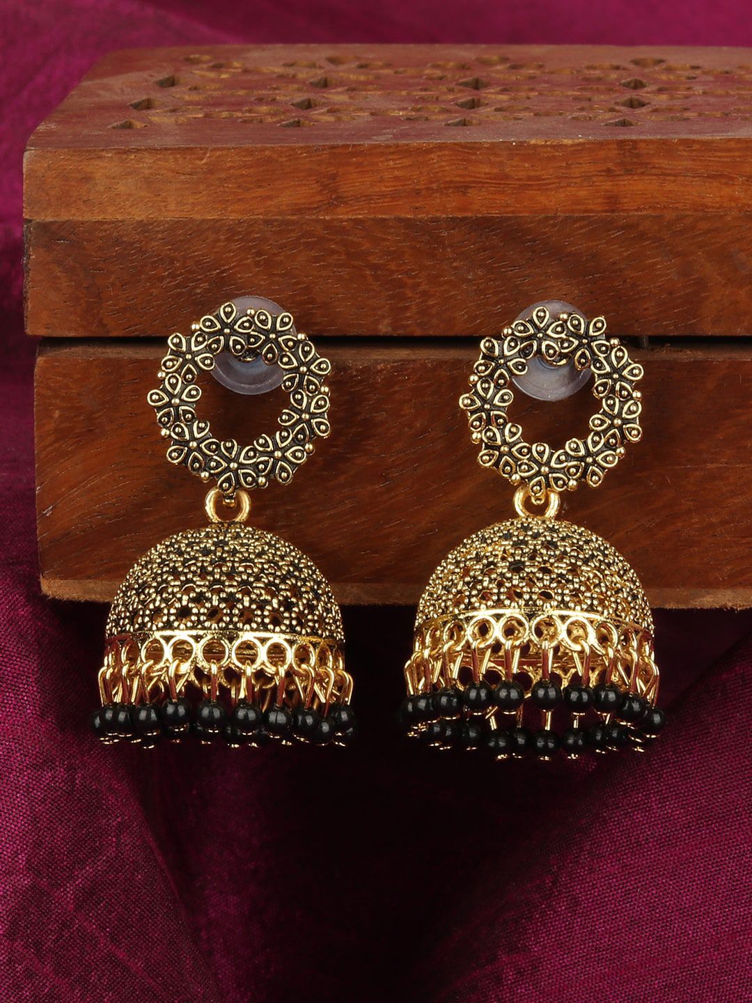 ANIKAS CREATION Gold-Plated & Black Dome Shaped Jhumkas Price in India