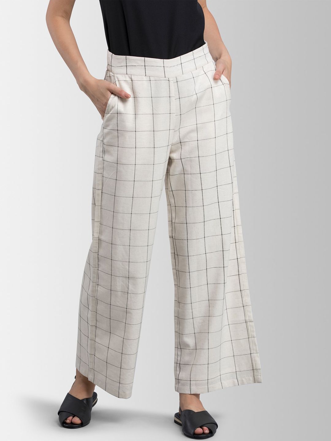 FableStreet Women Off-White & Black Loose Fit Checked Parallel Trousers Price in India