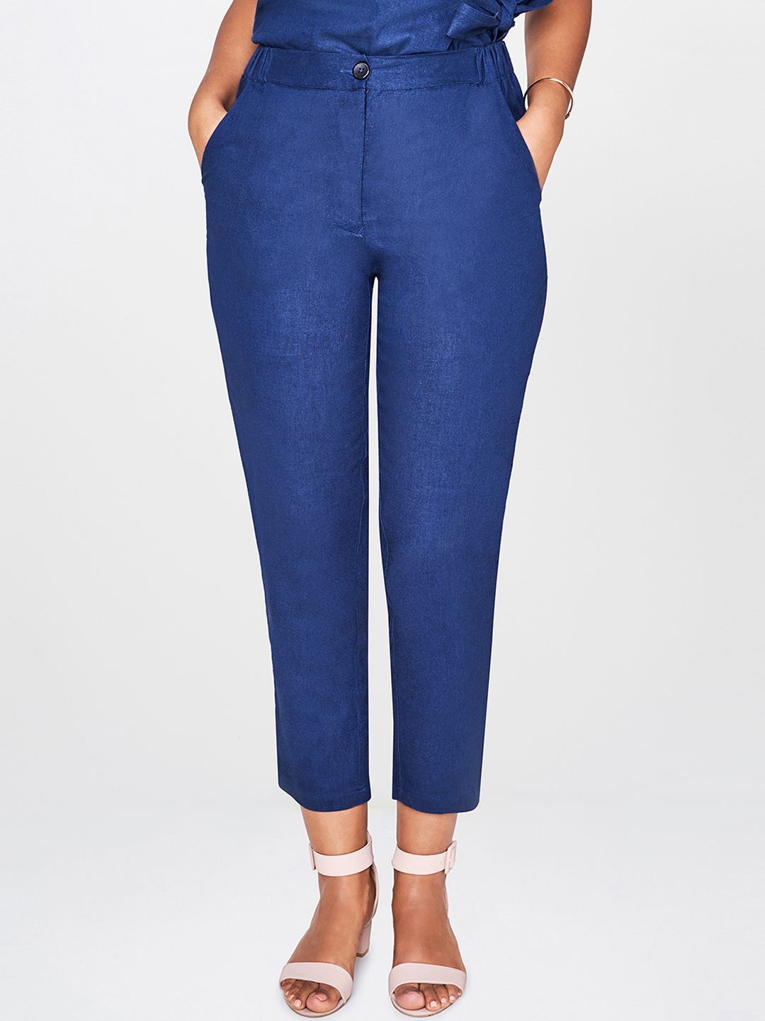 AND Women Blue Solid Peg Trousers Price in India