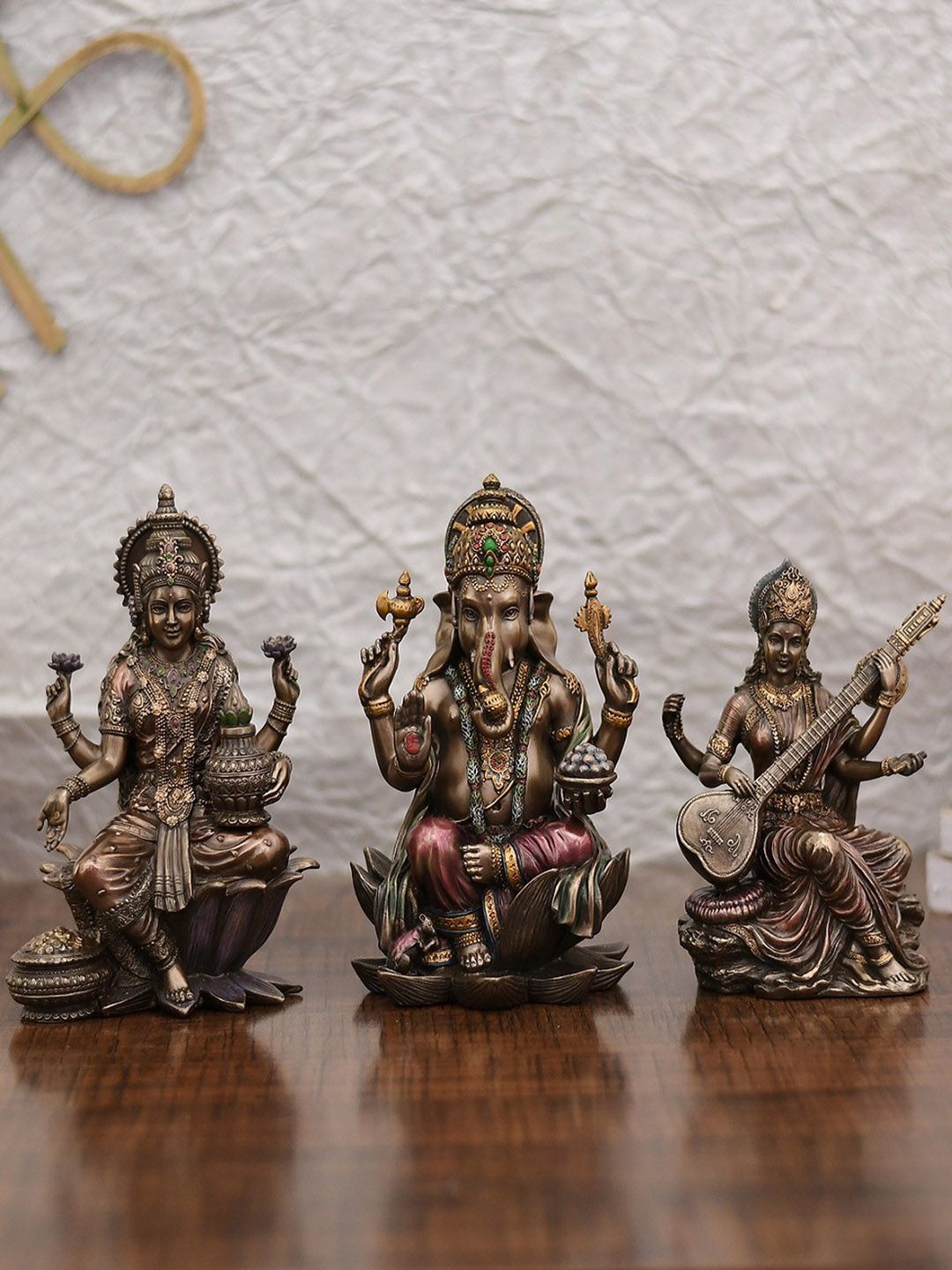 CraftVatika Set Of 3 Bronze-Toned Handcrafted Lakshmi Ganesha Saraswati Idol Showpiece Price in India