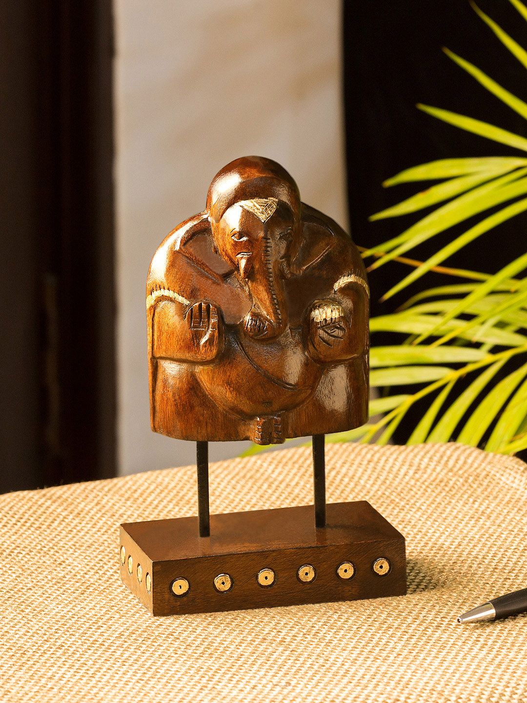 ExclusiveLane Brown & Gold-Toned Hand Carved Blessing Ganesha Wooden Sculpture Showpiece Price in India