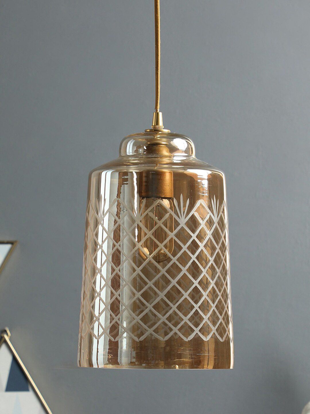 THE LIGHT STORE Gold-Toned Textured Pendent Lamp Price in India