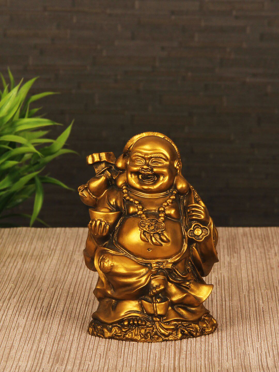 TIED RIBBONS Gold-Toned Laughing Buddha Figurine Showpiece Price in India