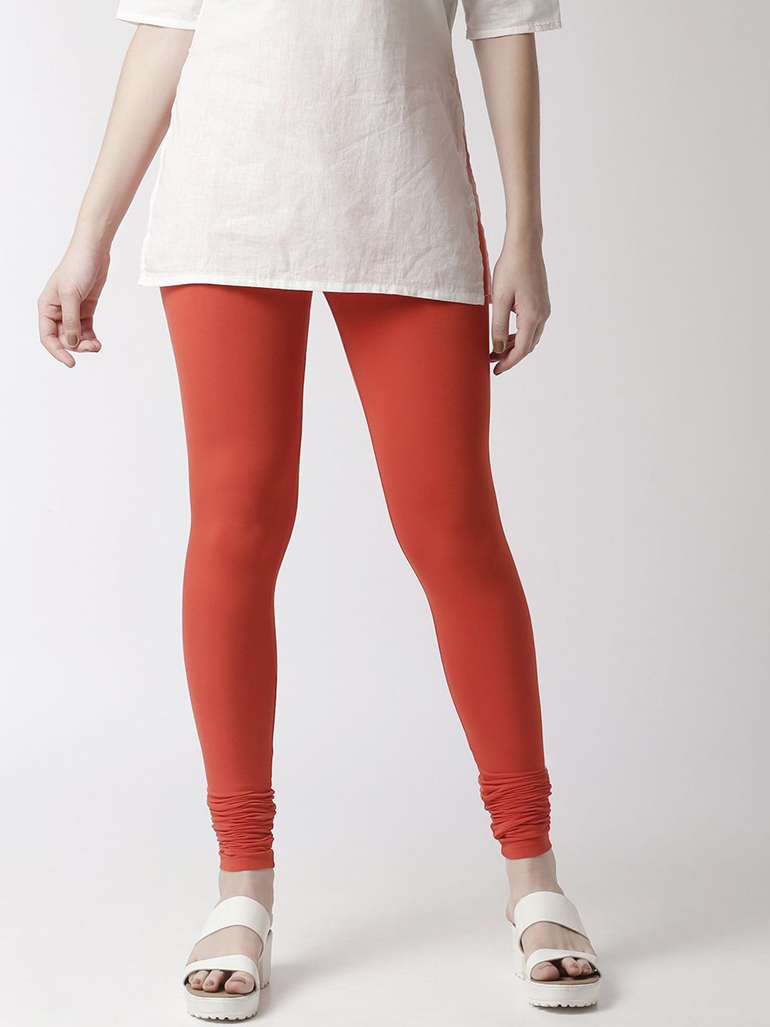 De Moza Women Rust Orange Solid Churidar-Length Leggings Price in India