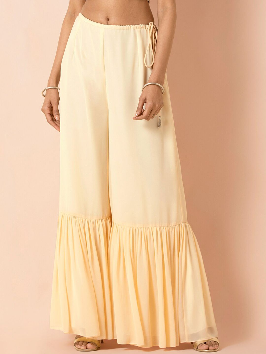 INDYA X PAYAL SINGHAL Women Cream-Coloured Solid Flared Palazzos Price in India