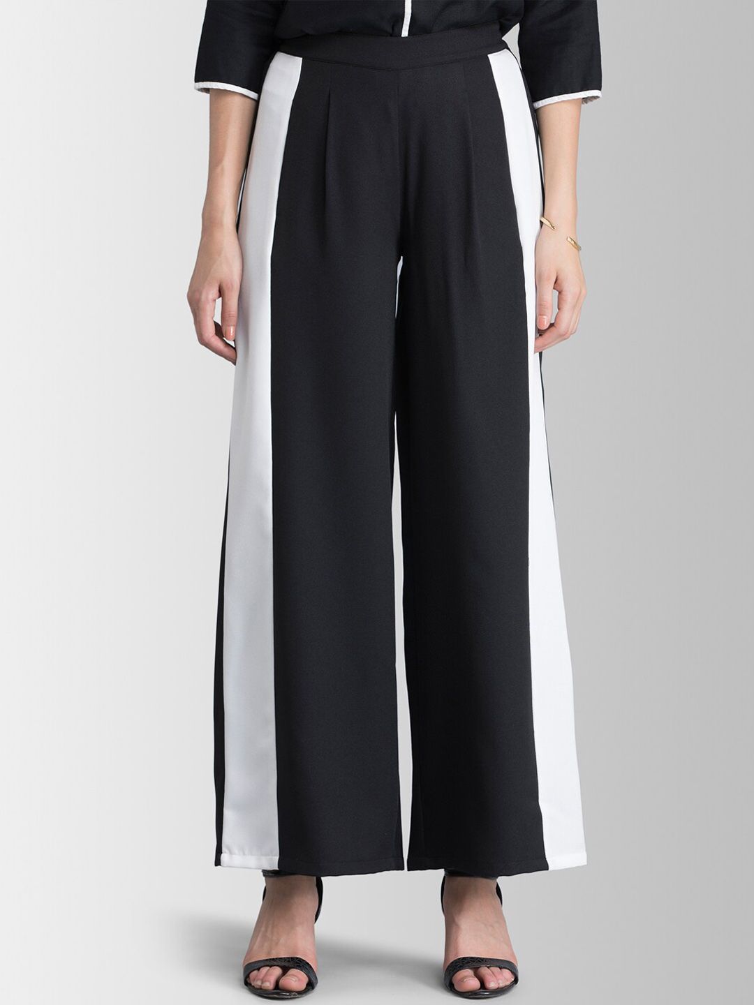 FableStreet Women Black & White Loose Fit Solid Parallel Trousers Price in India