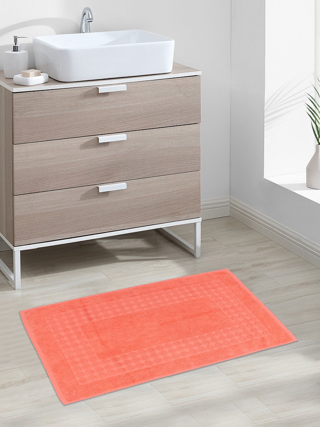 AVI Living Orange Textured 900 GSM Rectangular Bathmat Price in India