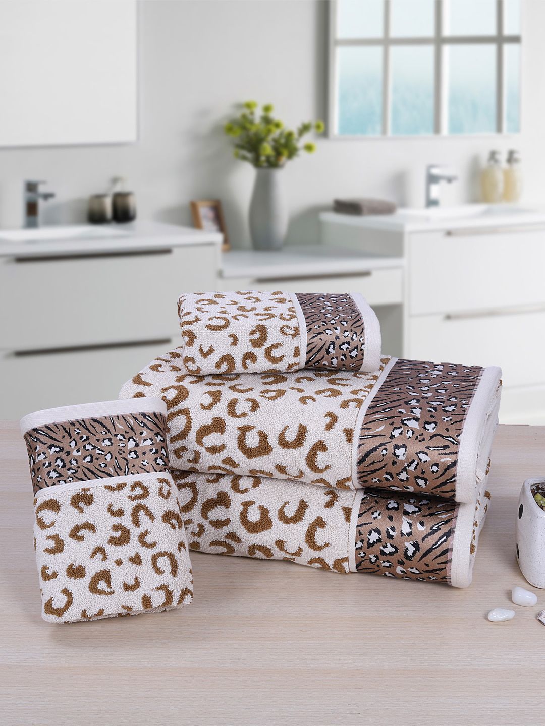 RANGOLI Set Of 4 White & Brown Leopard Printed 530 GSM Towels Price in India