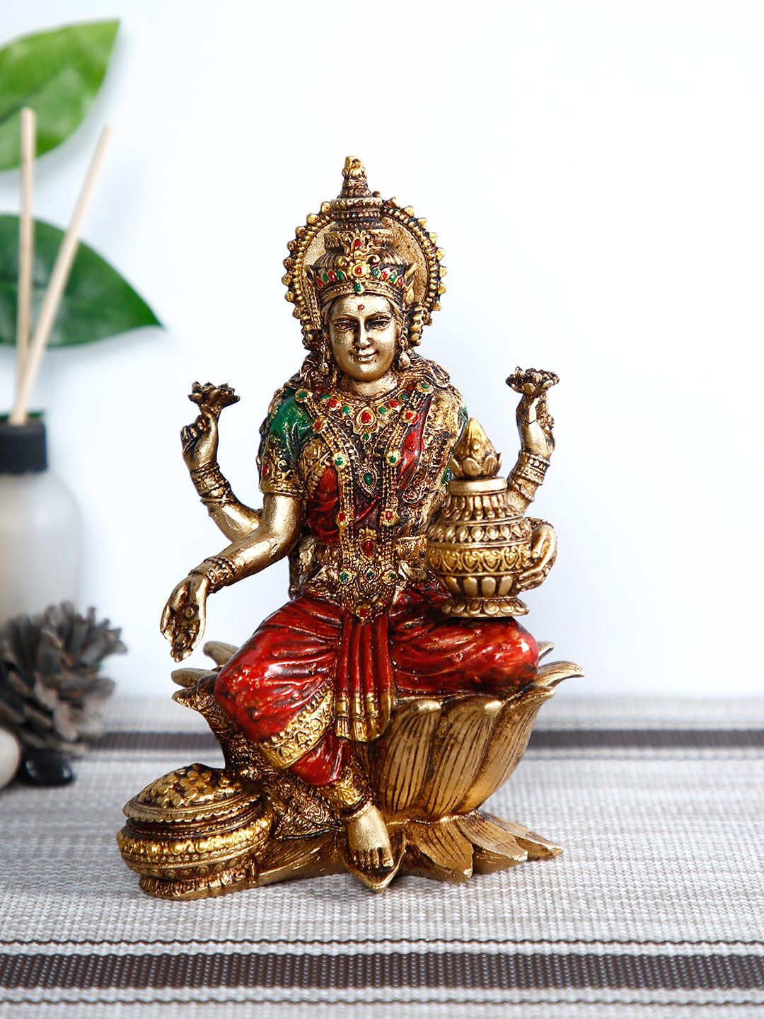 CraftVatika Gold-Toned & Red Lakshmi Devi Idol Handpainted Showpiece Price in India