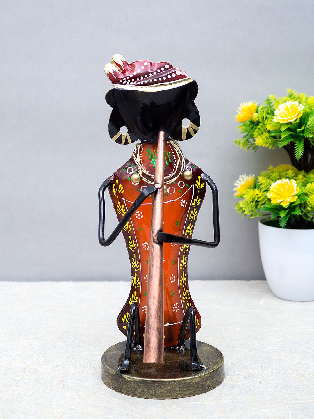 Golden Peacock Orange & Black Flute Musician Handcrafted Showpiece Price in India