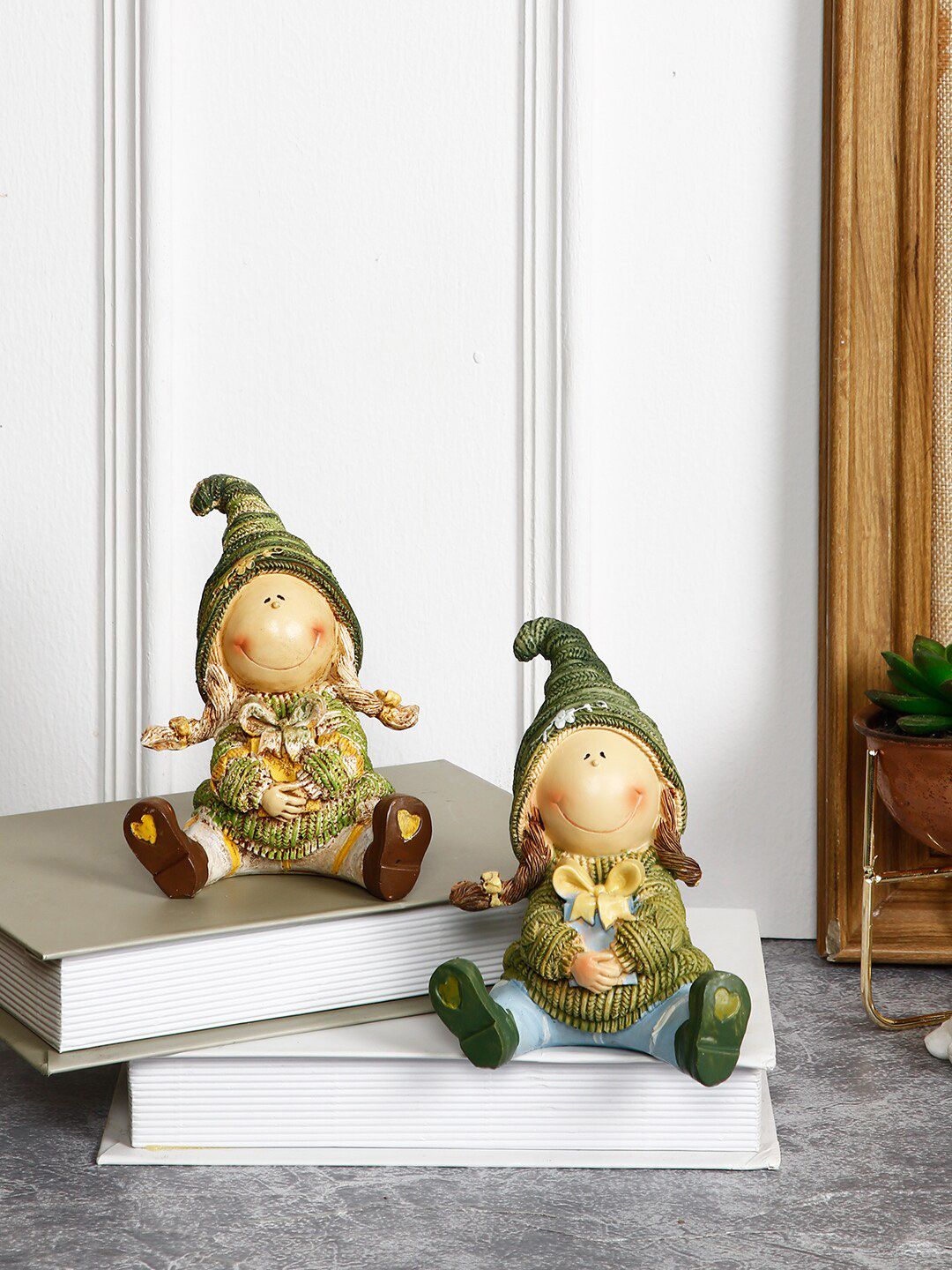 TAYHAA Set Of 2 Green & Beige Polyraisin Little Girl Showpieces Price in India