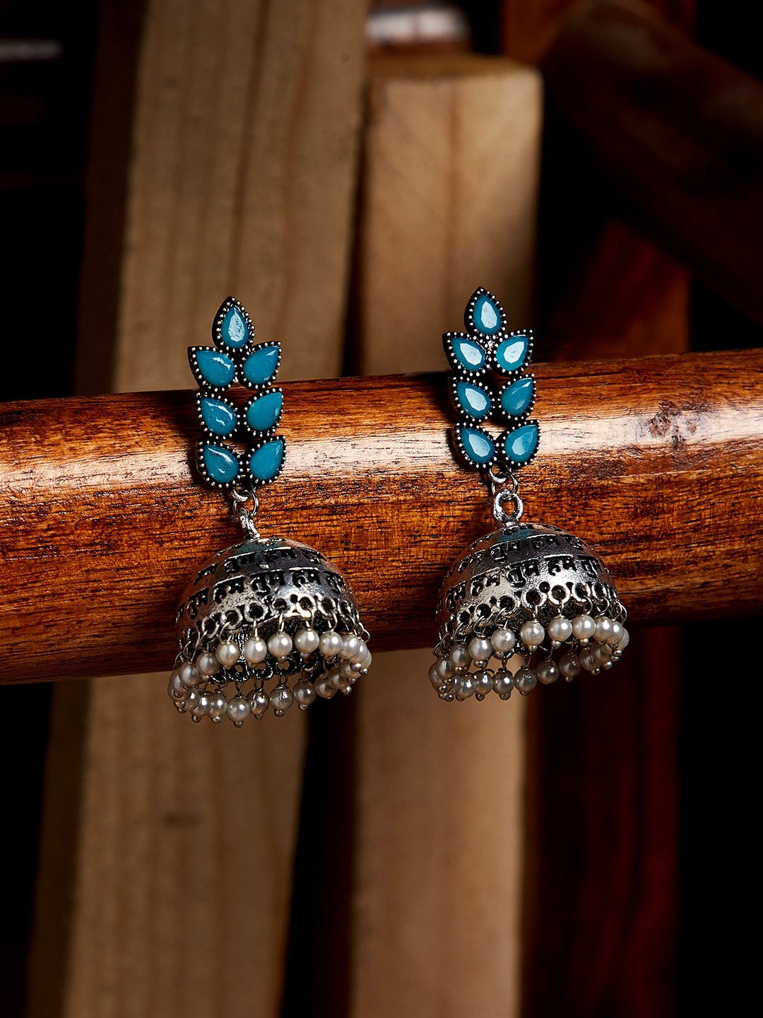 PANASH Silver-Toned & Blue Contemporary Jhumkas Price in India