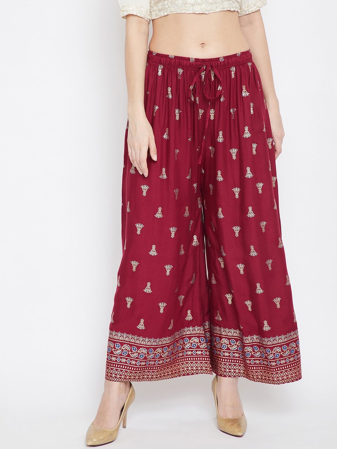 Clora Creation Women Maroon & Gold-Toned Printed Flared Palazzos Price in India