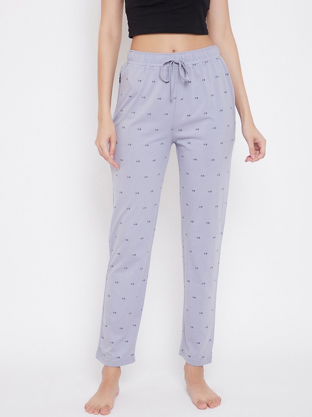 Okane Women Purple & Black Printed Lounge Pants Price in India