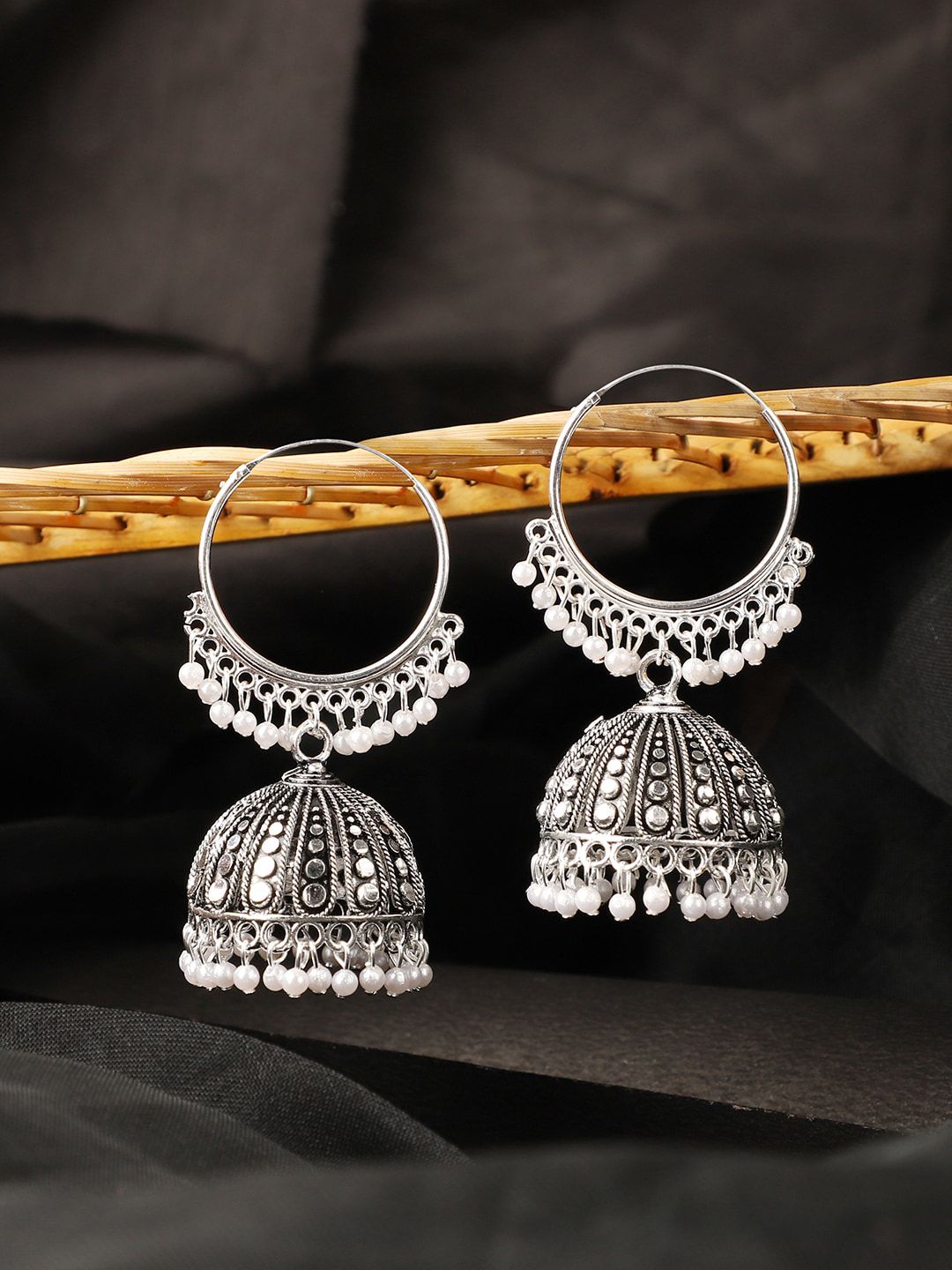 ANIKAS CREATION Silver-Toned Contemporary Jhumkas Price in India