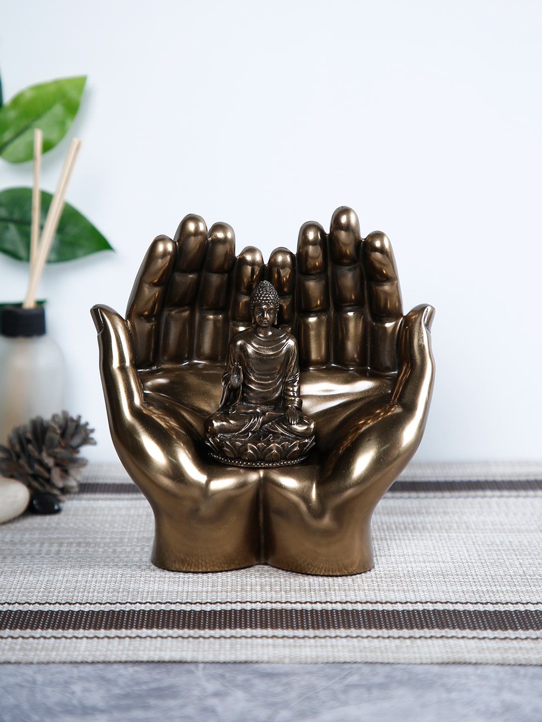 CraftVatika Gold-Toned Palm Buddha Idol Showpiece Price in India