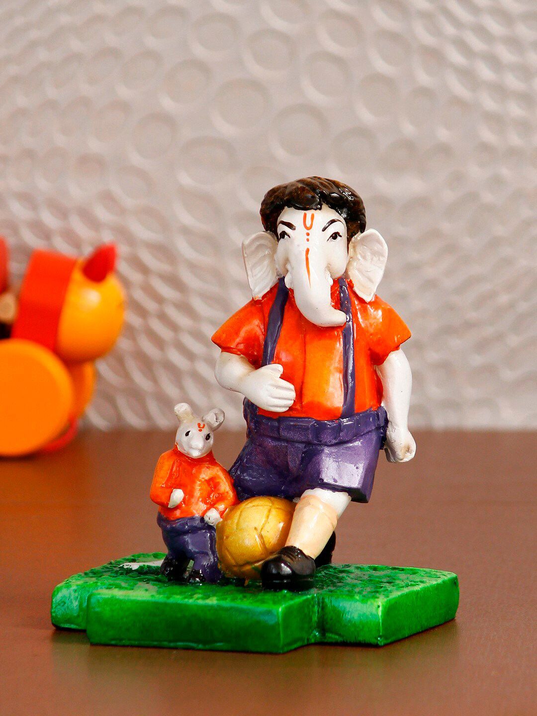 eCraftIndia Orange & Purple Lord Ganesha Playing Football With Mushak Handcrafted Decorative Figurine Showpiece Price in India