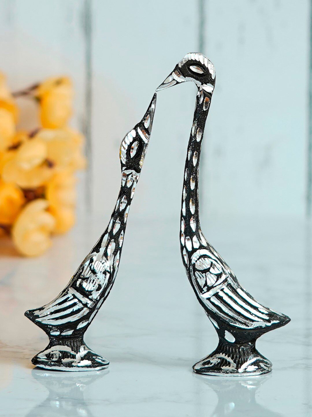 eCraftIndia Set Of 2 Black & Silver-Toned Engraved Kissing Swan Showpieces Price in India