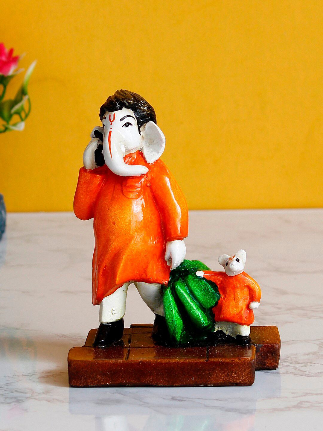 eCraftIndia Orange & White Lord Ganesha Doing Shopping with Mushak Handcrafted Showpiece Price in India