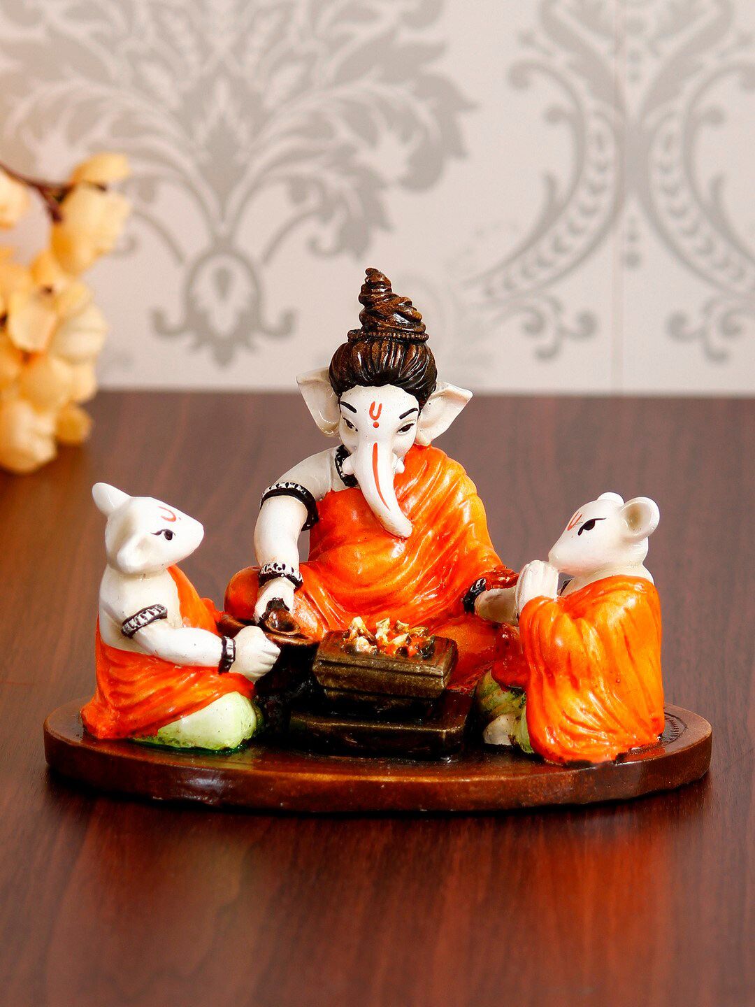 eCraftIndia Orange & Brown Handcrafted Lord Ganesha Doing Havan With 2 Mushaks Figurine Showpiece Price in India