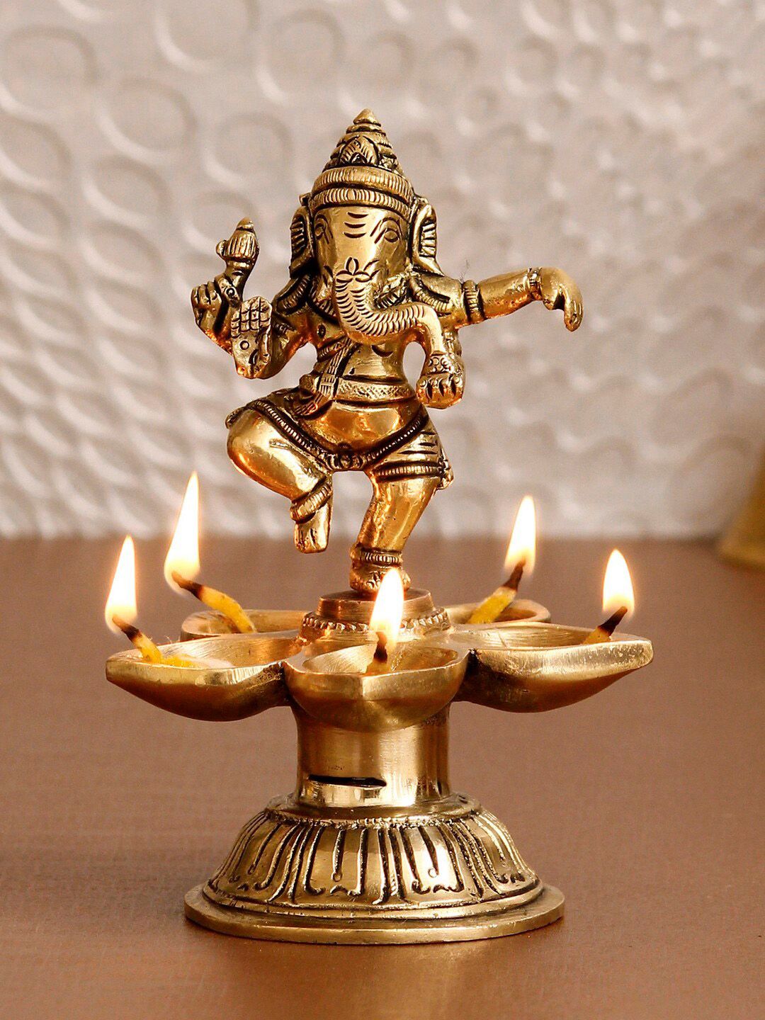eCraftIndia Gold-Toned Handcrafted Dancing Lord Ganesha Showpiece With Diya Price in India