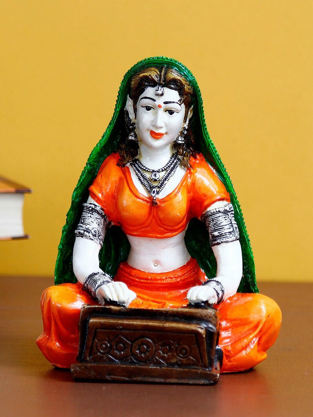 eCraftIndia Orange & Green Rajasthani Lady Playing Harmonium Handcrafted Decorative Polyresin Showpiece Price in India