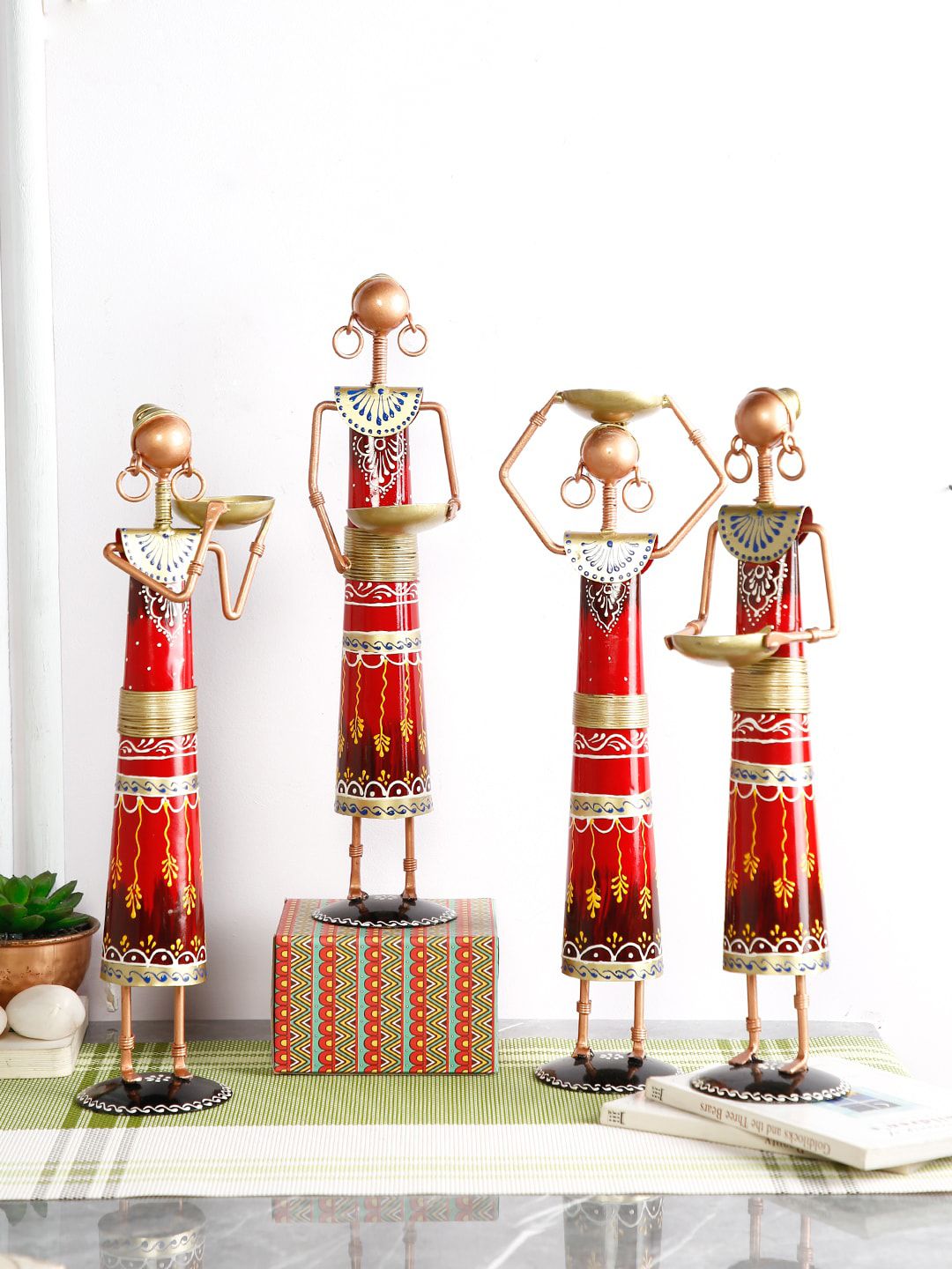 CraftVatika Set Of 4 Red & Gold-Toned Handcrafted Village Lady Showpiece Price in India
