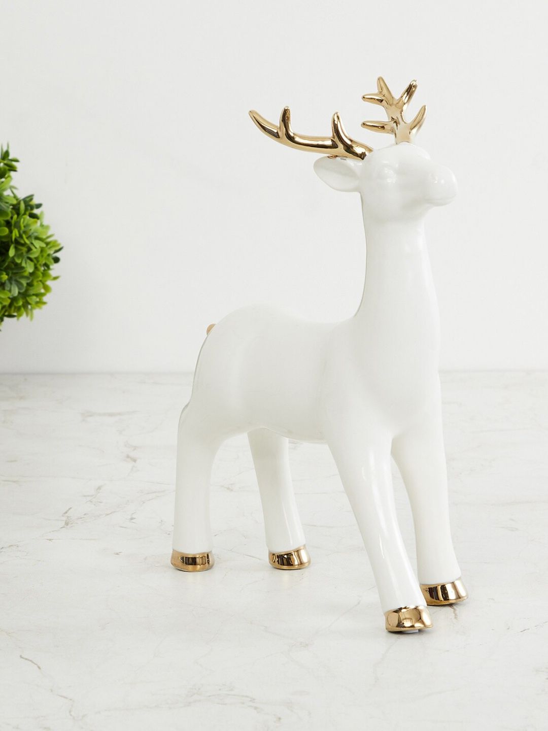 Home Centre White & Rose Gold-Toned Brighton Ceramic Standing Reindeer Figurine Showpiece Price in India