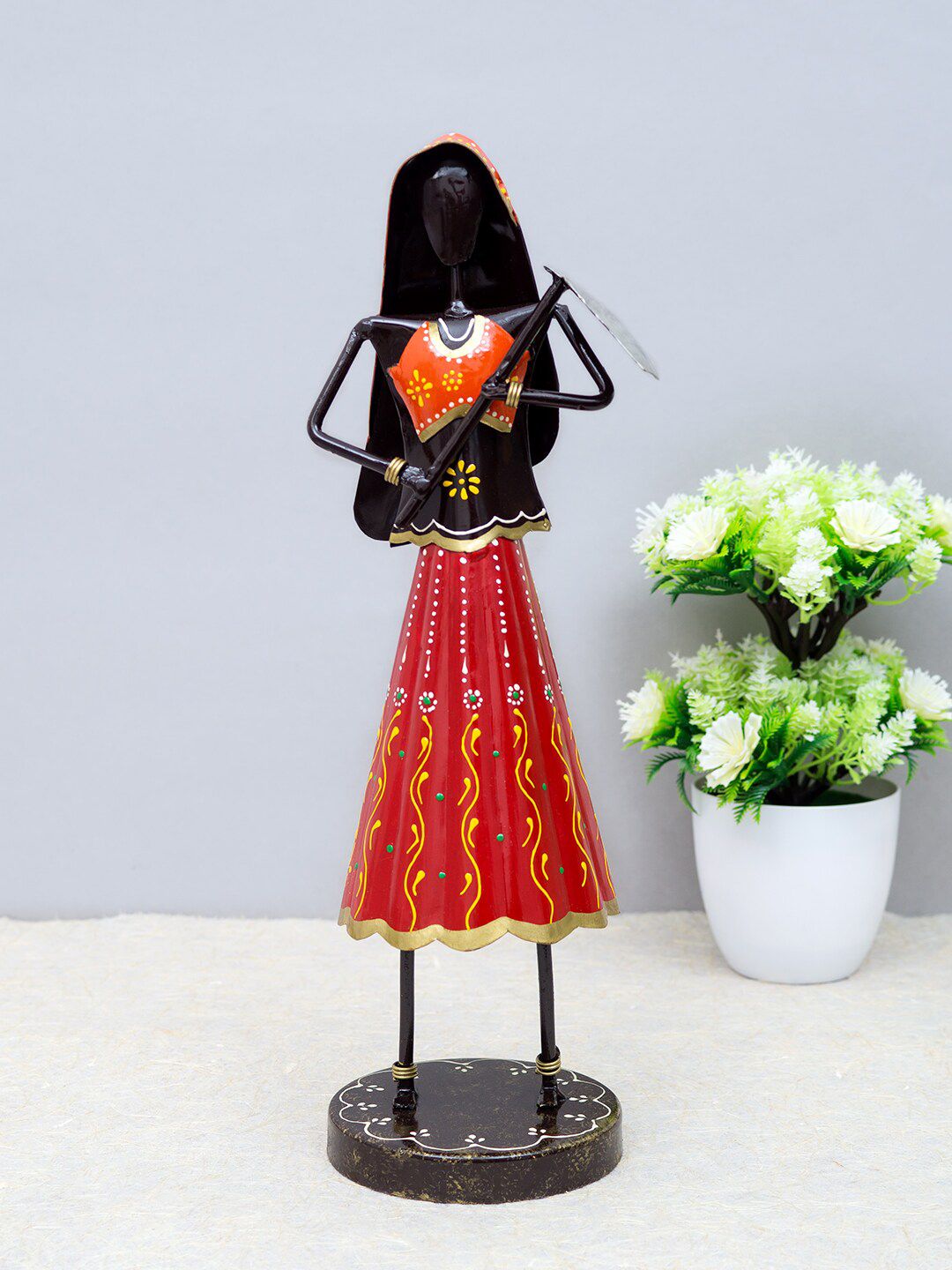 Golden Peacock Red & Black Lady Farmer Showpiece Price in India