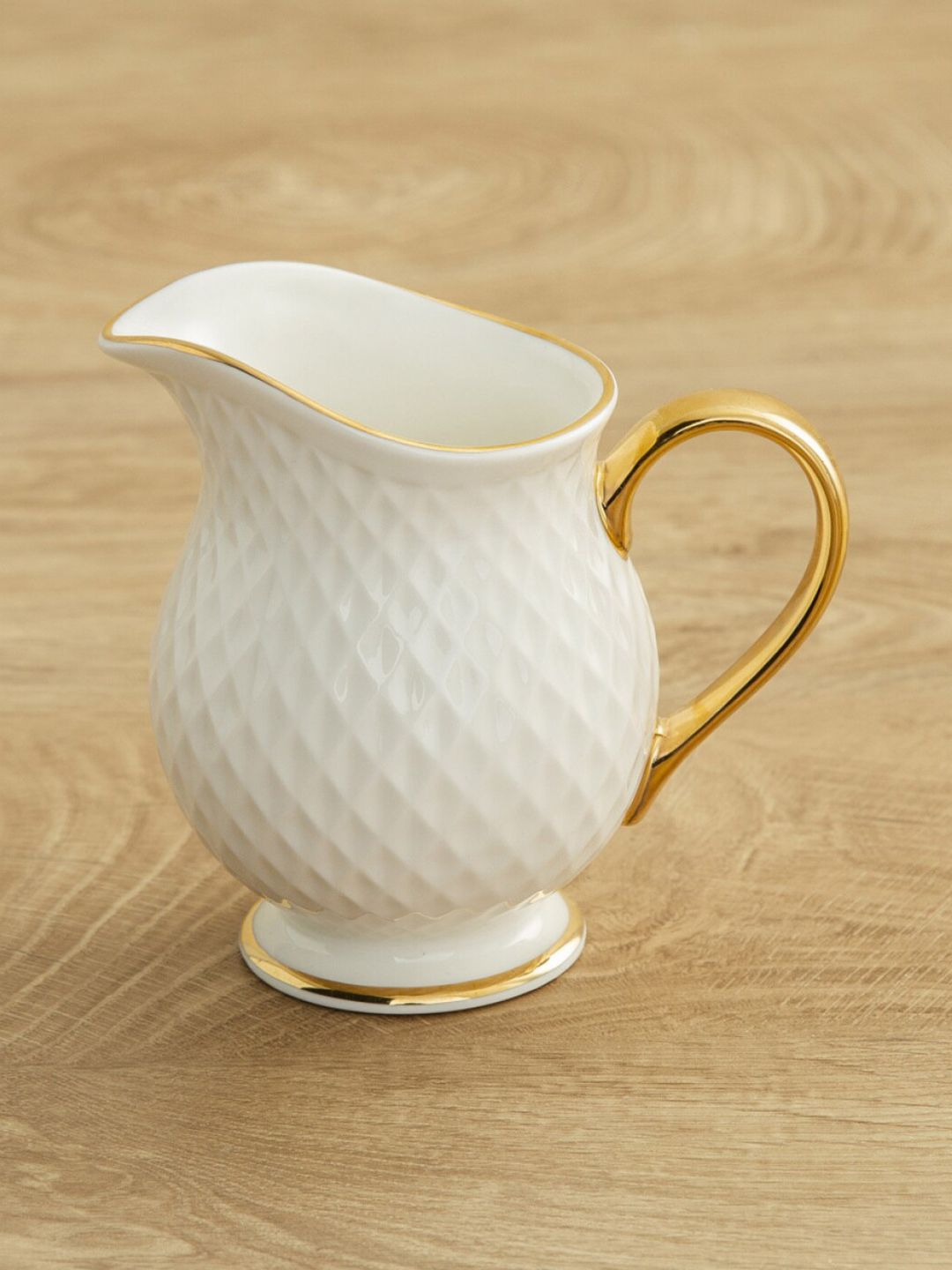 Home Centre White & Gold-Toned Geometric Textured Ceramic Matte Creamer Price in India